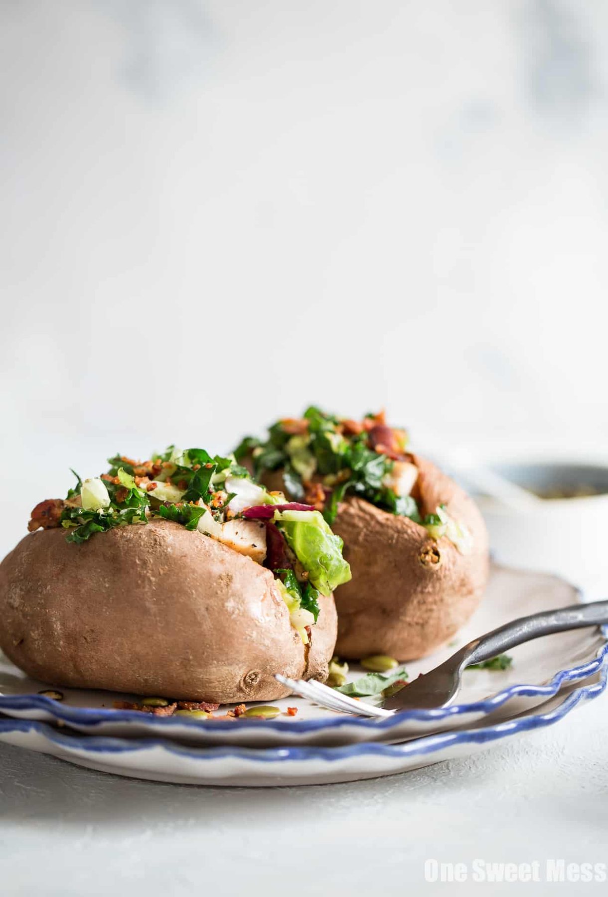 Grilled Chicken & Sweet Kale Salad Stuffed Sweet Potatoes: Loaded with grilled poppy seed dressing glazed chicken and topped with sweet kale salad tossed in warm bacon vinaigrette. Hearty, healthy and gluten-free.