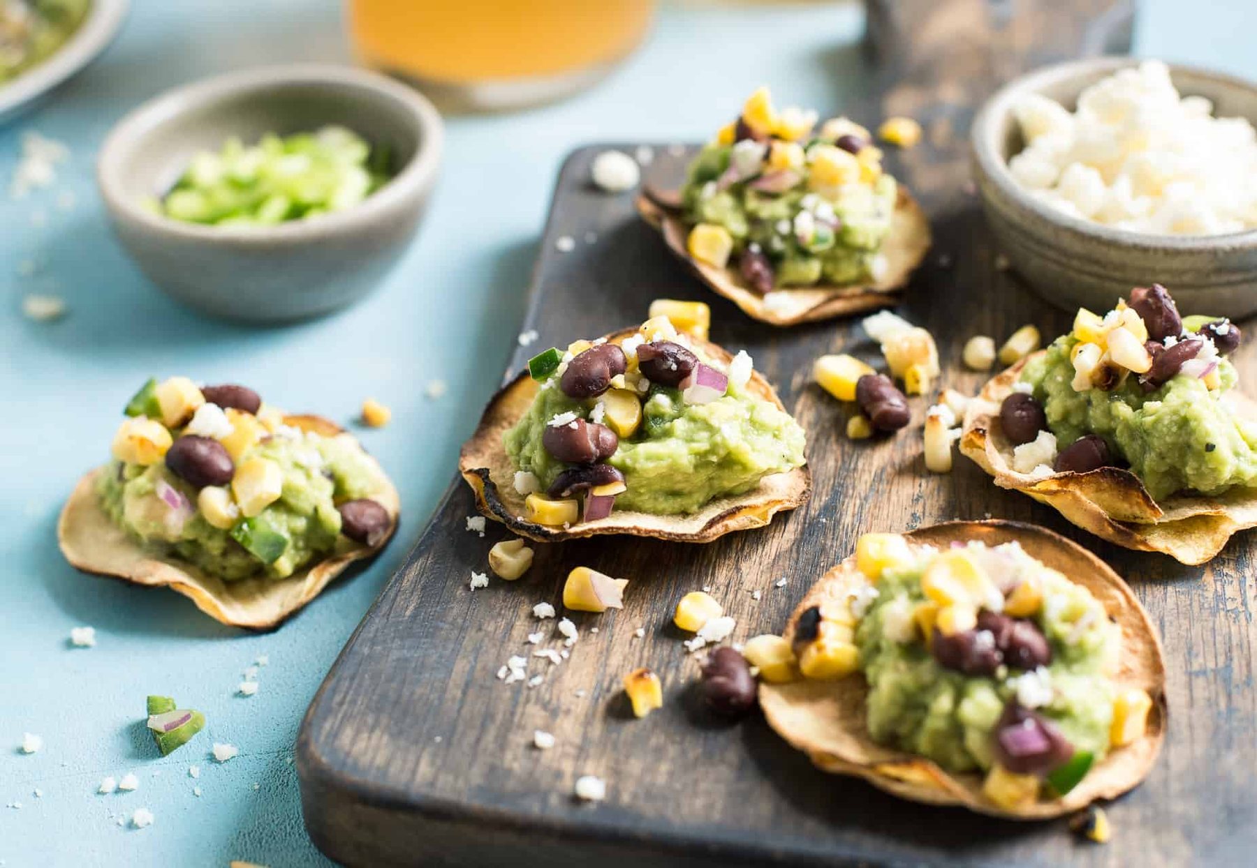 Grilled Corn Salsa & Guacamole Tostadas: This crispy bite-sized appetizer is perfect for football season. They're gluten-free and healthy with a vegan option.