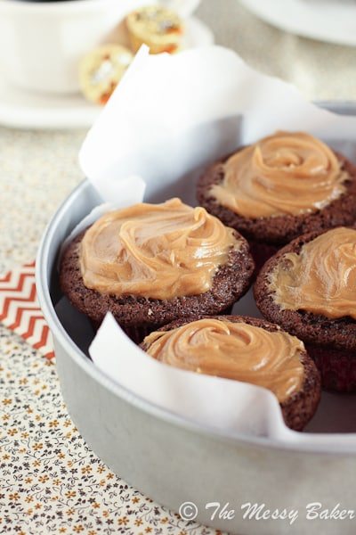 Peanut Butter Cup Stuffed Chocolate Muffins with Peanut Butter Frosting
