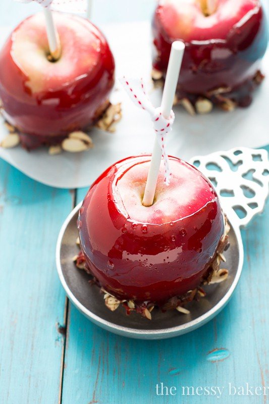 Red Moscato Candied Apples Dipped in Toasted Almonds and Semi-Sweet Chocolate | www.themessybakerblog.com