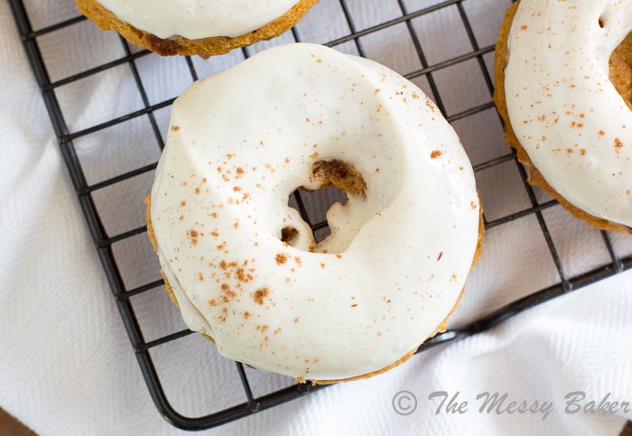 Skinny Pumpkin Cinnamon Chip Donuts with Maple Cream Cheese Glaze | www.themessybakerblog.com -8477