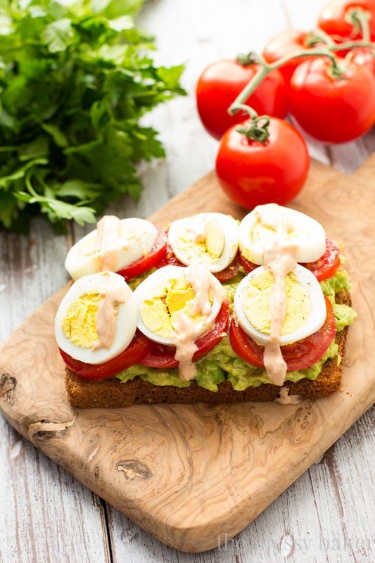 Healthy Avocado, Tomato, and Sliced Egg Toast. This open-faced sandwich is perfect for breakfast or lunch.