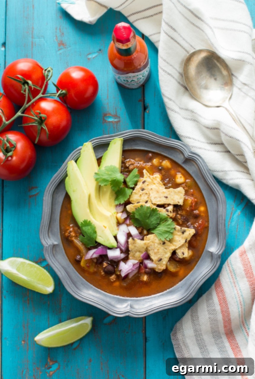 Bowl of Chorizo Taco Soup with avocado and cilantro