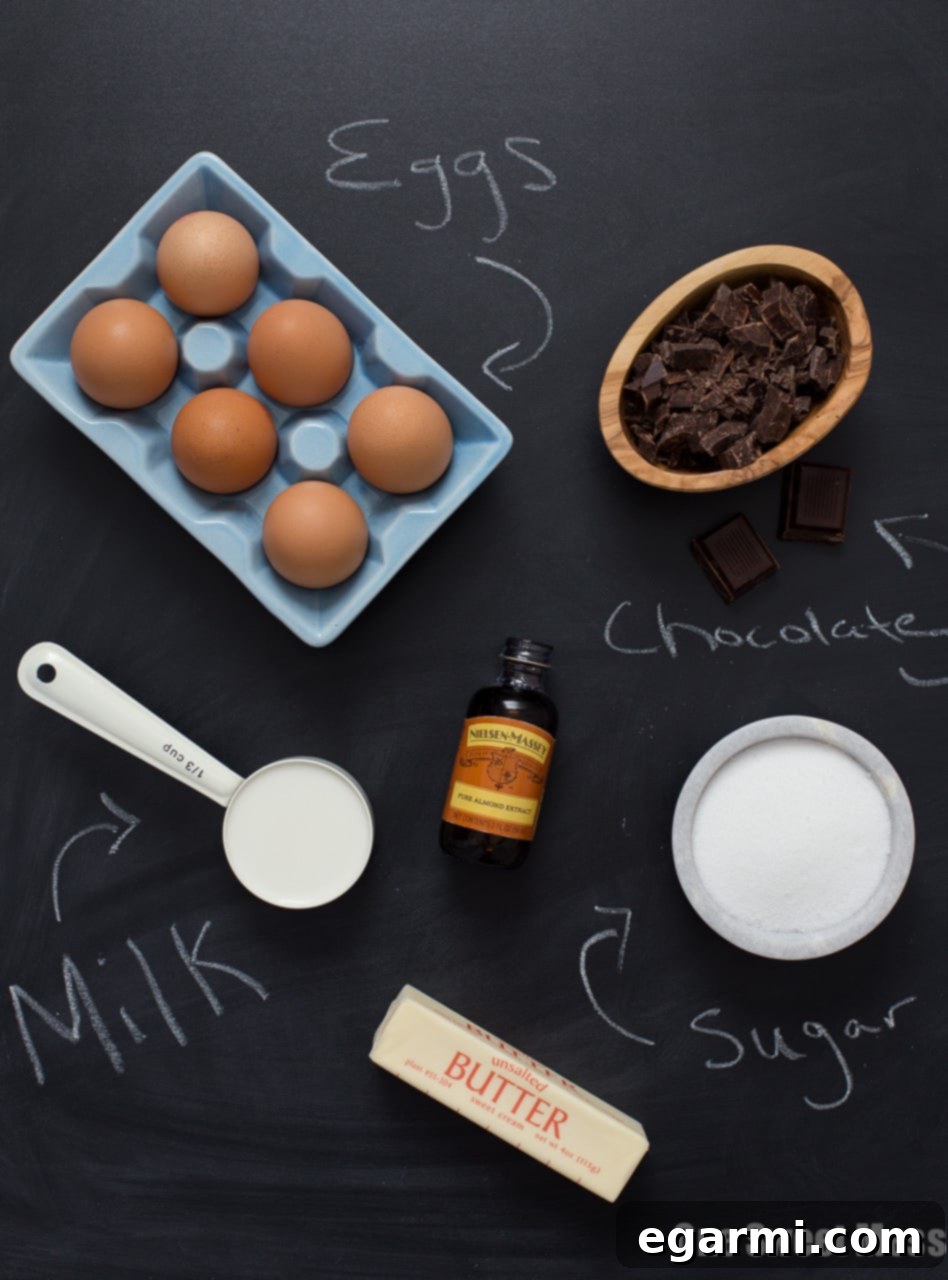 Individual ramekins of Chocolate Almond Soufflés, showcasing their elegant presentation