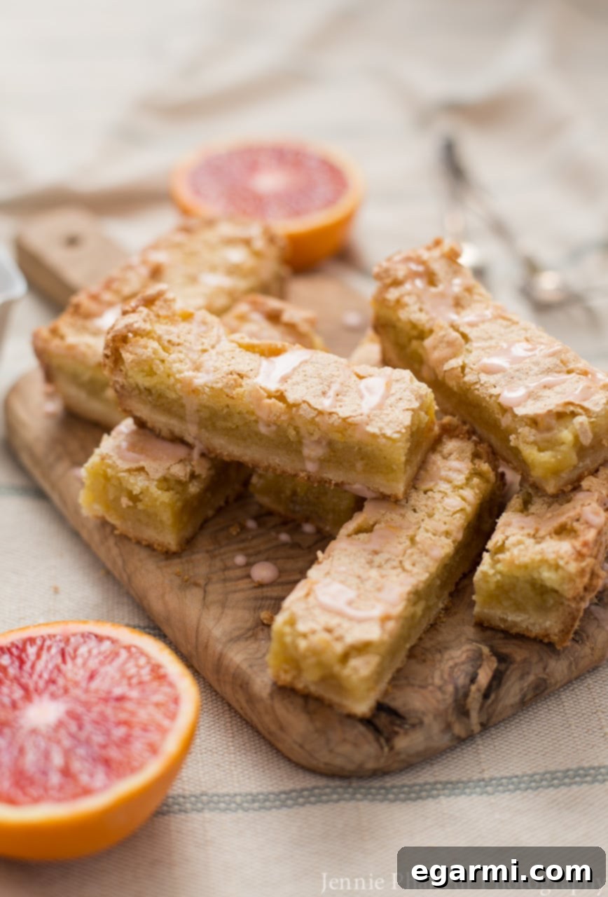 Blood Orange Bliss Bars, Vanilla Kissed 3 Close-up of freshly cut blood oranges showcasing their deep pink and red flesh, highlighting their unique color and flavor