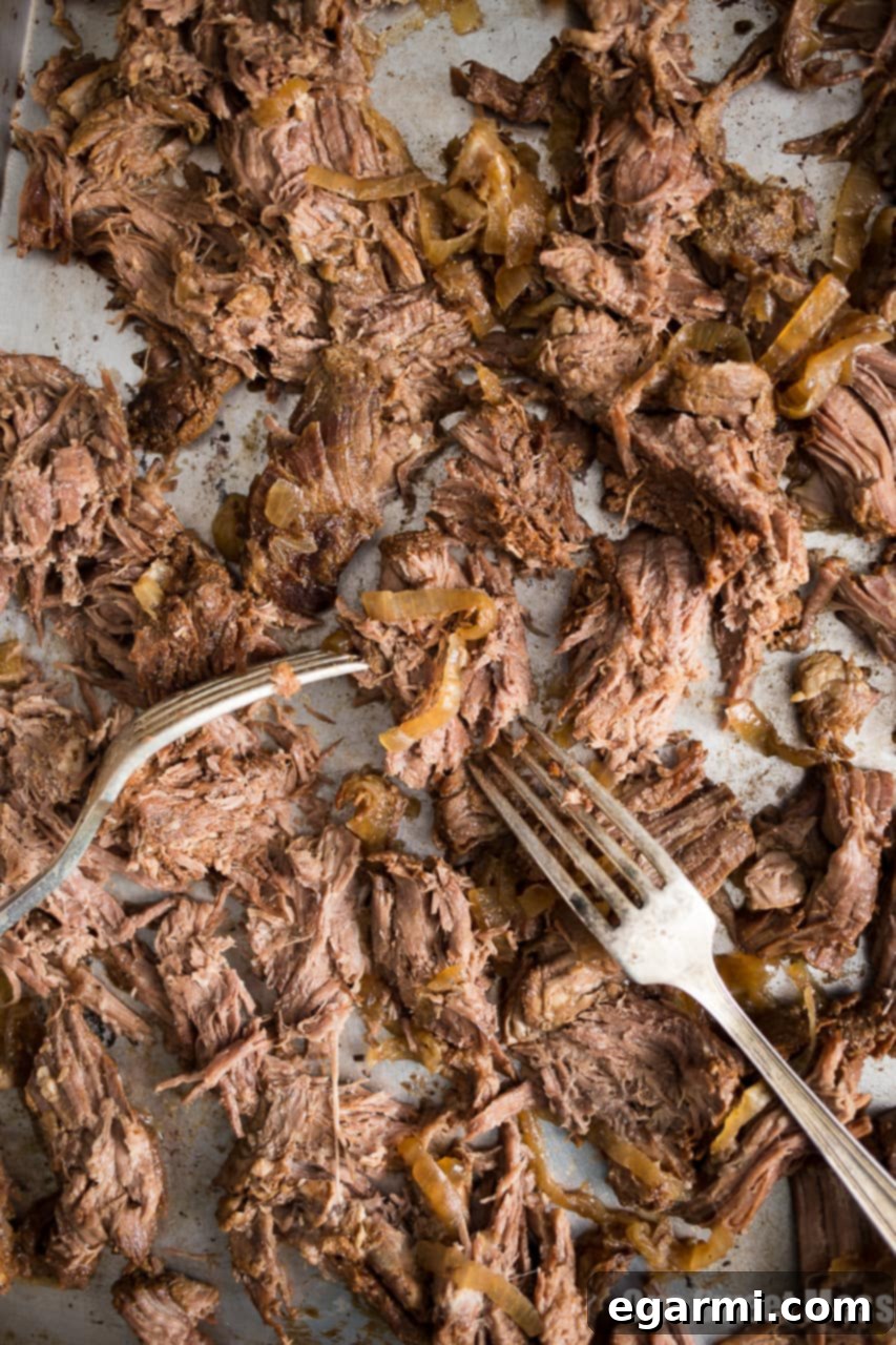 Slow Cooker Guinness Shredded Beef – rich, tender, and infused with stout beer