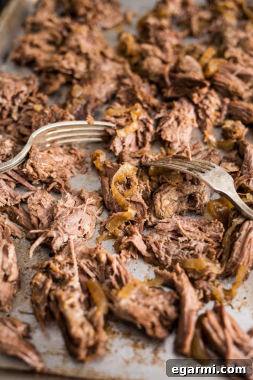 Platter of Slow Cooker Guinness Shredded Beef, garnished and ready to serve