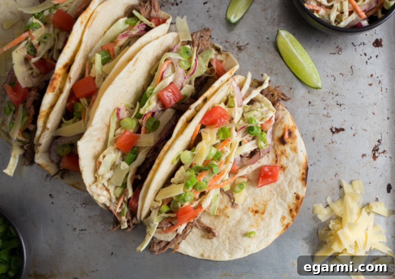 Zesty Mustard Slaw Shredded Beef Tacos 4 Guinness Shredded Beef Tacos with Mustard Slaw - Delicious Layers