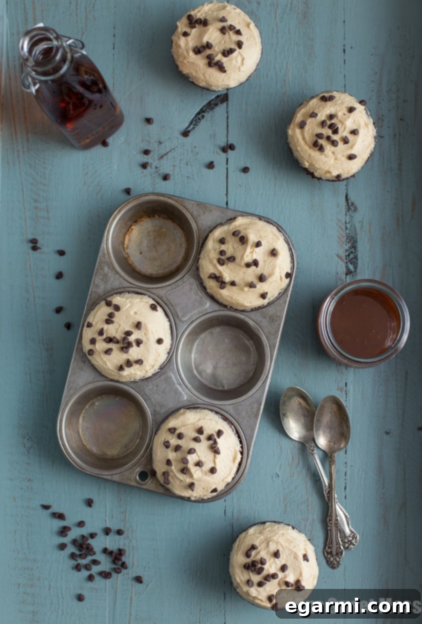 Rich Chocolate Stout Cupcakes topped with Whiskey Caramel Buttercream, a perfect dessert