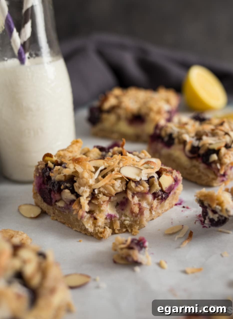 Blueberry Coconut Cheesecake Bars on a serving platter