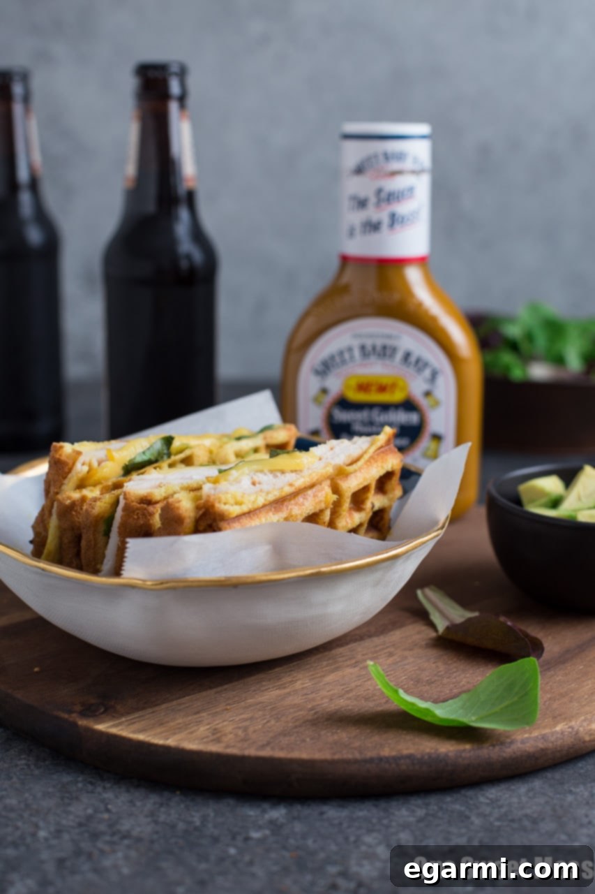 Turkey Smoked Gouda Waffle Panini 4 Expertly crafted Waffle Iron Turkey Smoked Gouda Panini on toasted bread with sauce