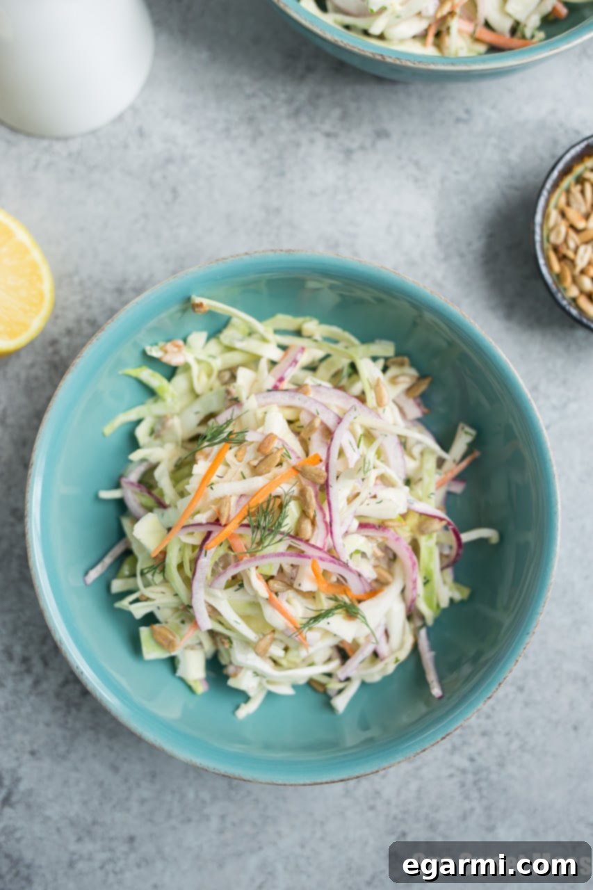 Close-up of freshly shredded cabbage and carrots for coleslaw