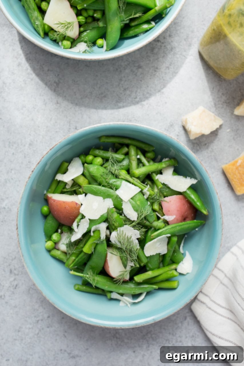 Vibrant Spring Pea and Asparagus Salad with a Zesty Lemon Dill Vinaigrette, perfect for seasonal dining.