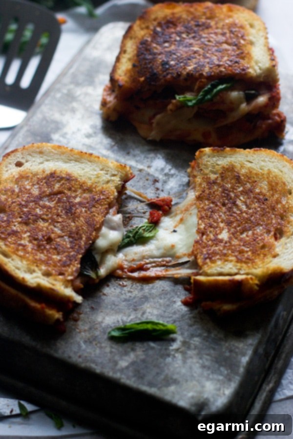Innovative Pizza Margherita Grilled Cheese with melted cheese and fresh basil, a creative Thursday dinner