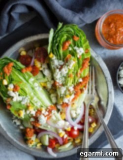 Grilled Corn & Tomato Salad with Roasted Red Pepper Vinaigrette in a serving bowl