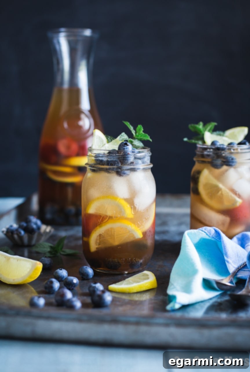 Refreshing Blueberry Sweet Tea Lemonade Sangria in a pitcher with fresh fruit