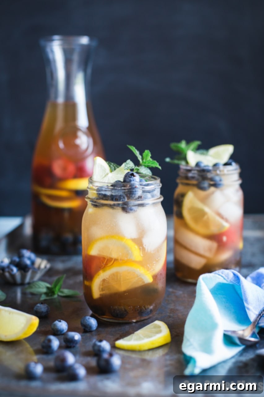 Blueberry Sweet Tea Lemonade Sangria pitcher with lemon slices and blueberries