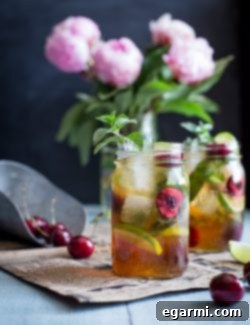 Final Black Cherry Mule cocktail with a lime wedge and mint sprig garnish