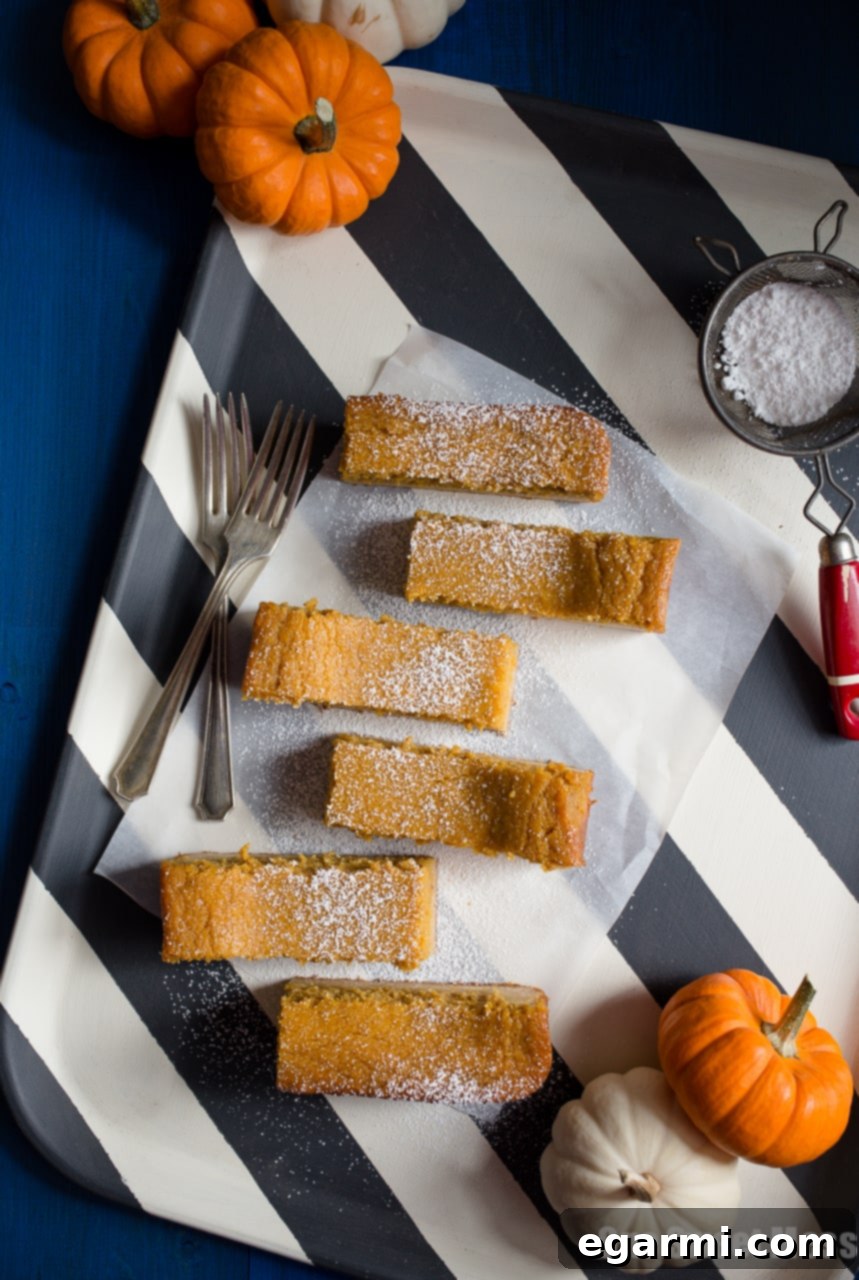 Delicious slice of Pumpkin Pie Gooey Butter Cake with a creamy top layer