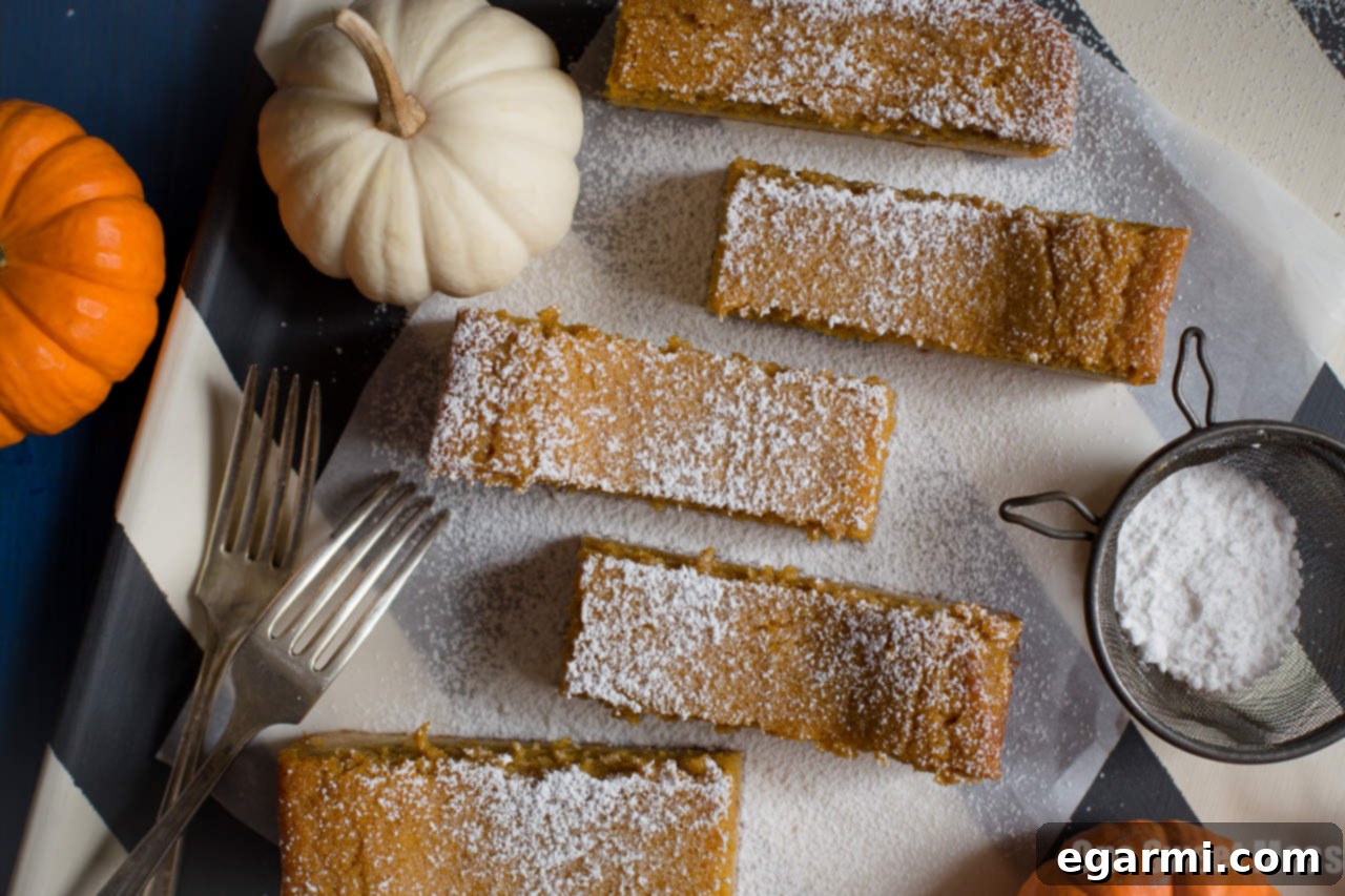 Cross-section view of Pumpkin Pie Gooey Butter Cake showing layers
