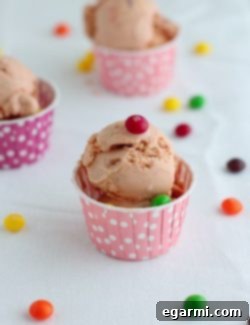 A vibrant bowl of Taste the Rainbow Skittles Ice Cream.