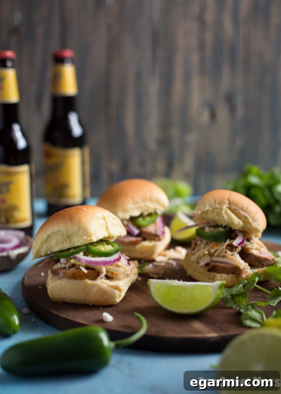 A close-up of Chipotle Pork Sliders with Honey Lime Slaw, showcasing the vibrant ingredients