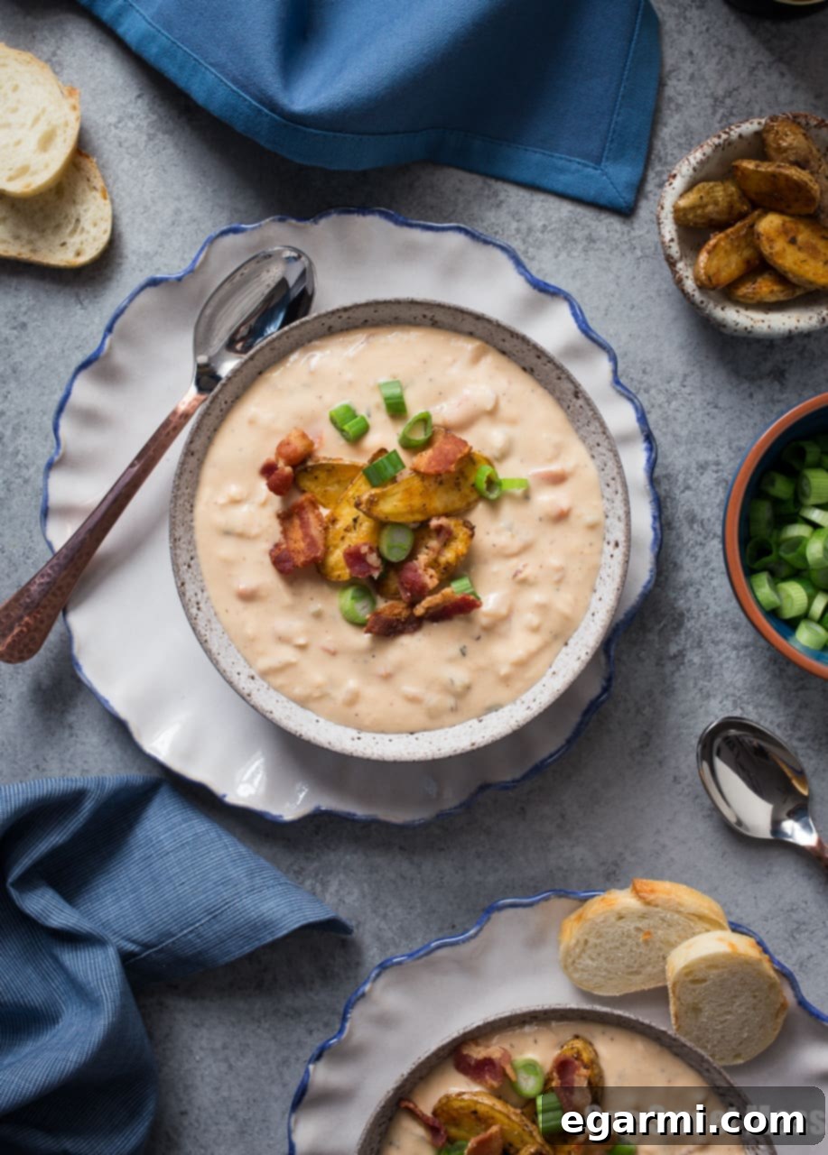 A bowl of Bacon Beer Cheese Soup with a spoon, ready to be enjoyed
