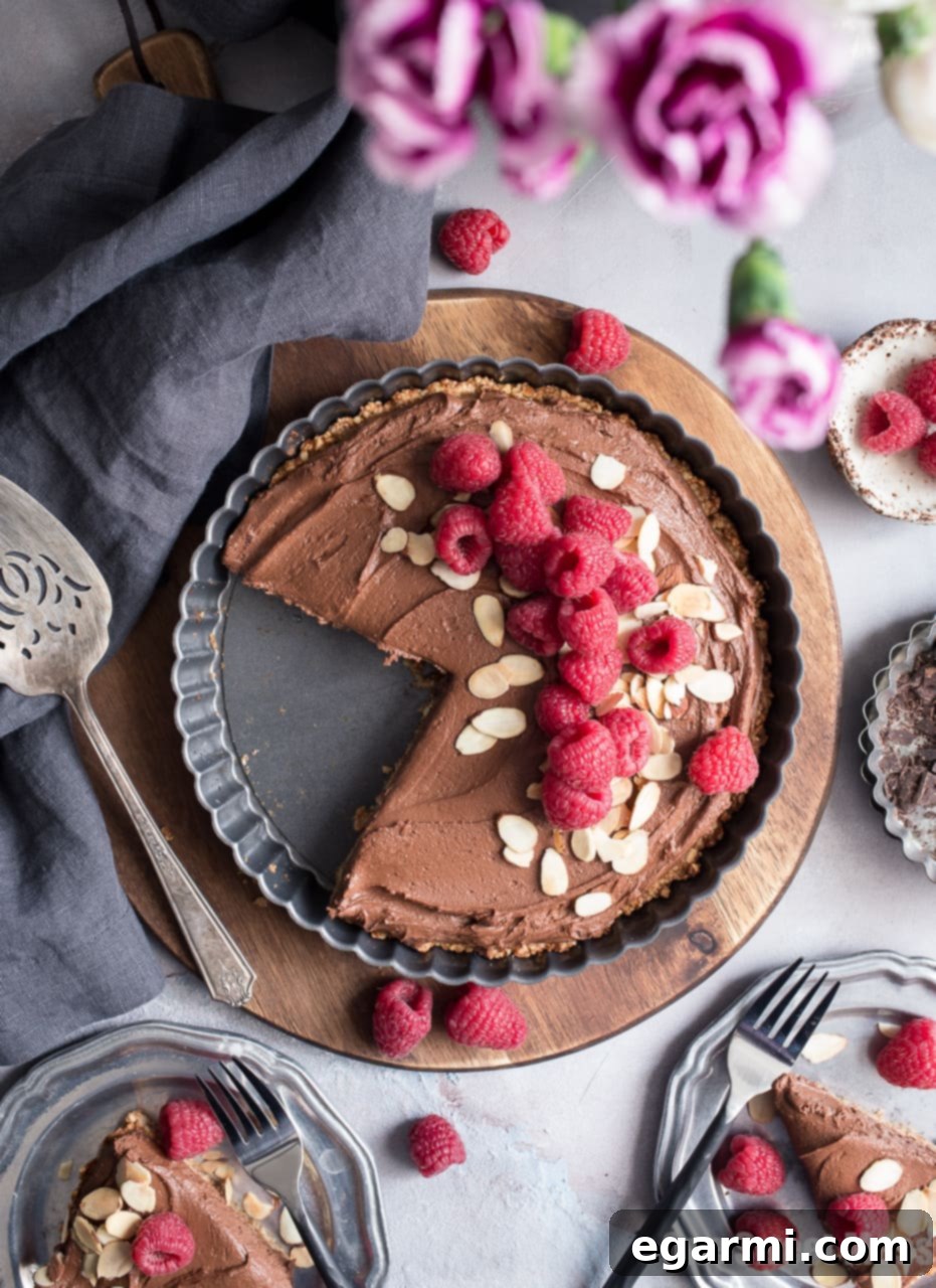 Dark Chocolate Almond Tart: This rich, creamy, ultra chocolate-y tart is vegan, gluten-free, grain-free, soy-free, and egg-free. This decadent tart is perfect for Valentine's Day.