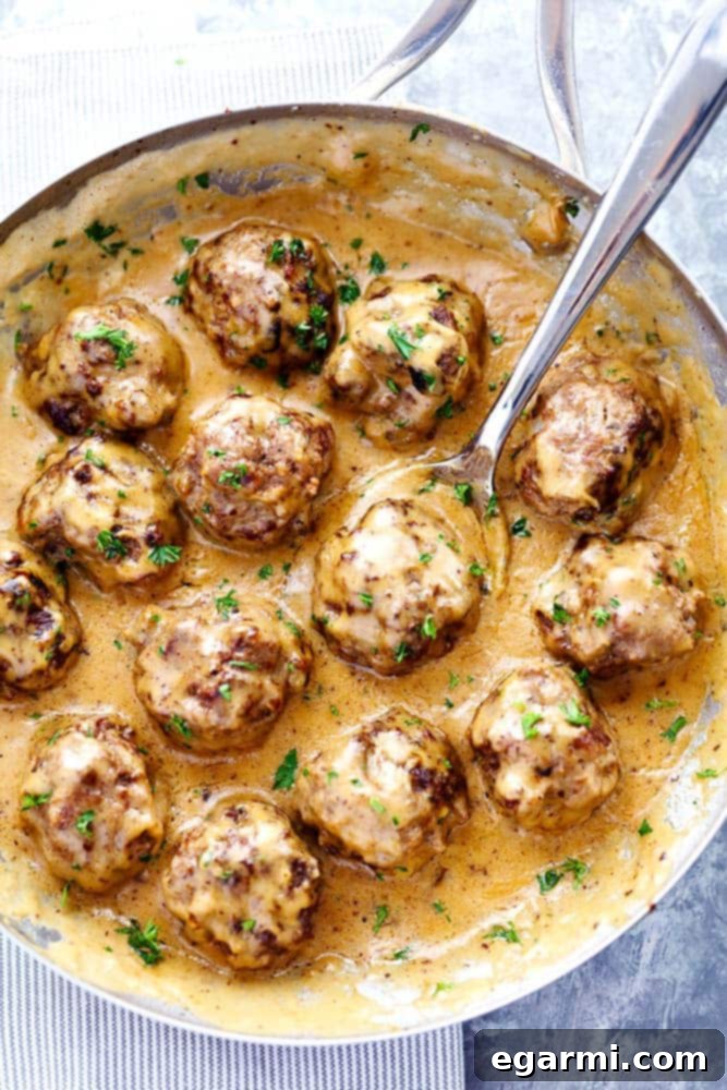 Delicious Swedish Meatballs in Creamy Sauce with Lingonberry Jam