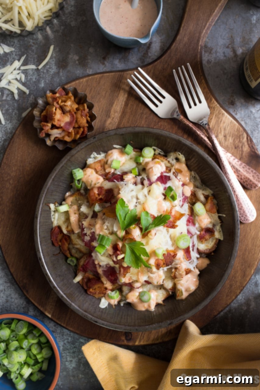 Reuben Irish Nachos: Crispy potato base with corned beef, Swiss cheese, and sauerkraut.