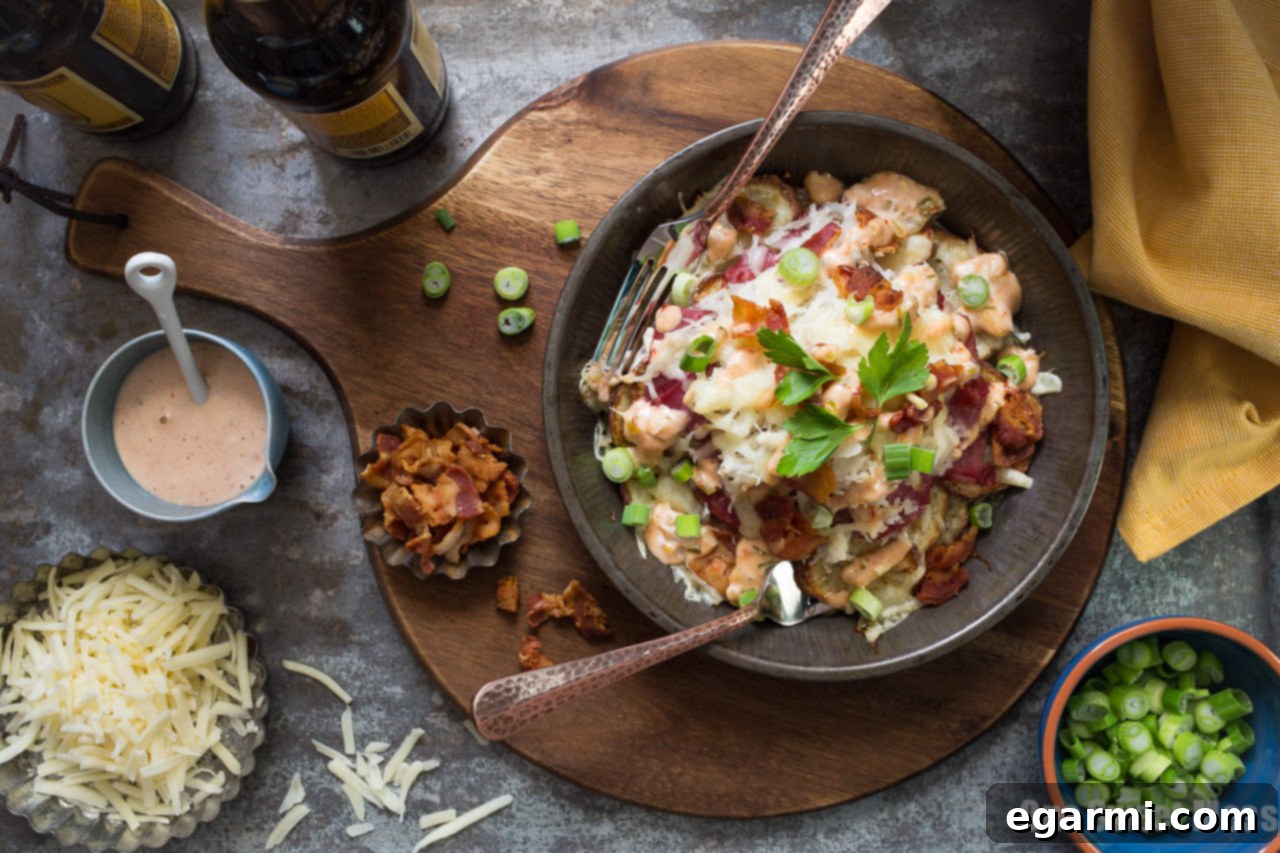 Reuben Irish Nachos served on a baking sheet, ready to eat.