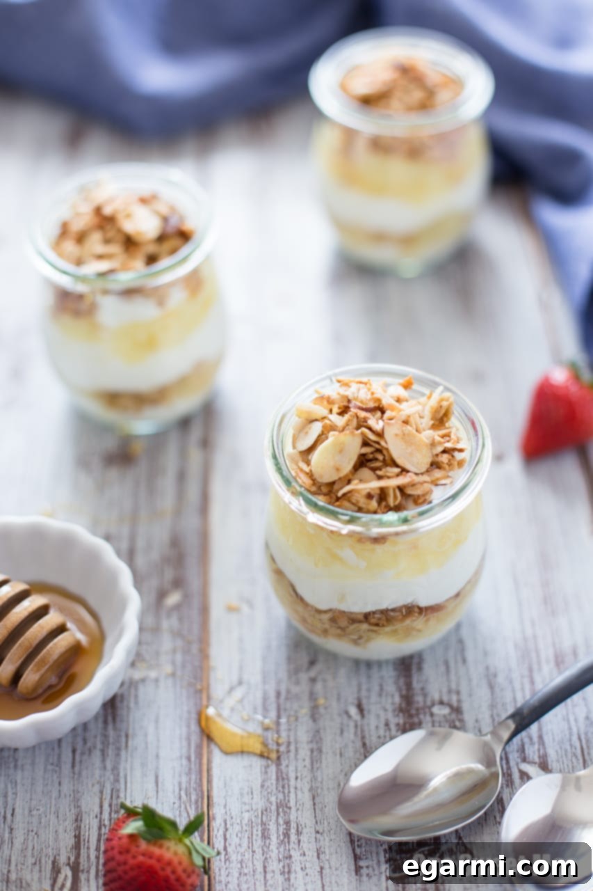 Delicious and healthy Pina Colada Yogurt and Honey Parfait in a glass jar