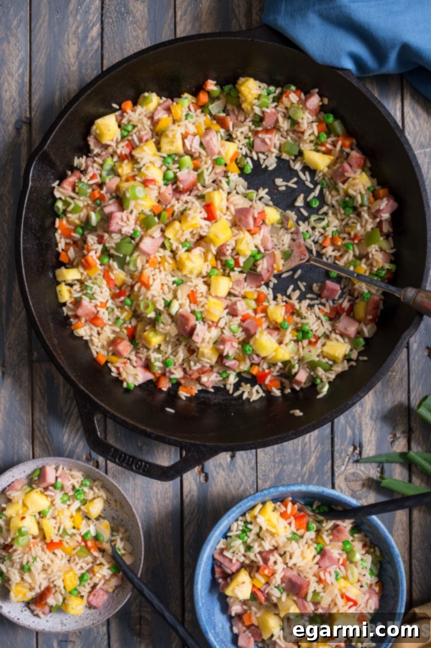 Freshly chopped scallions garnishing Pineapple Ham Fried Rice