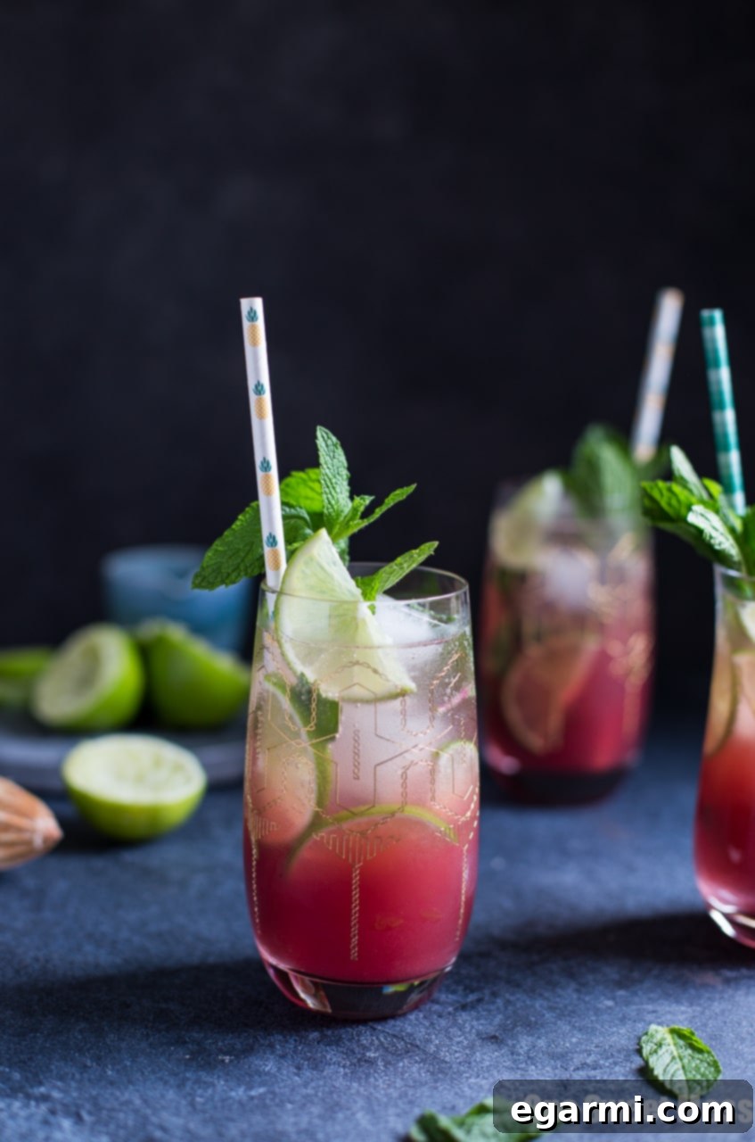 Delicious Pineapple Cranberry Mojito cocktail on a rustic wooden table