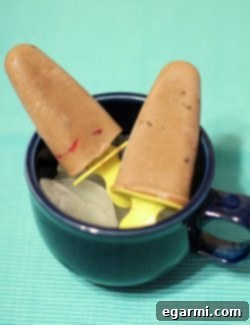 Finished Chocolate Covered Strawberry Fudgesicles on a plate