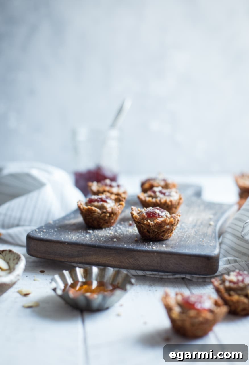 Close-up of Honey Almond Butter Mini Granola Cups with jam topping