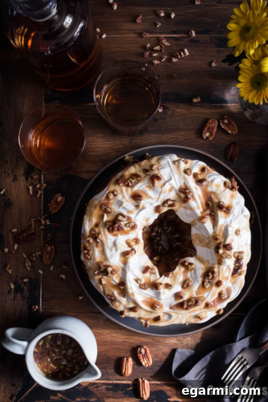 Close-up of a slice of Sweet Potato Bundt Cake showing its moist texture and pecan center