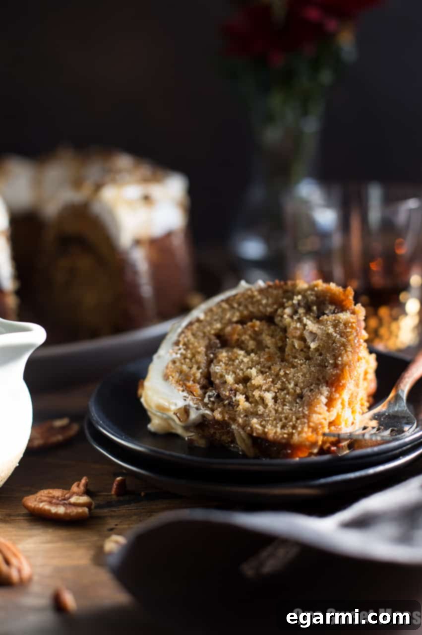Sweet Potato Bundt Cake on a serving platter, beautifully frosted and ready for guests
