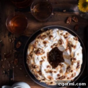 Sweet Potato Bundt Cake with Marshmallow Frosting and Bourbon Pecan Caramel Drizzle