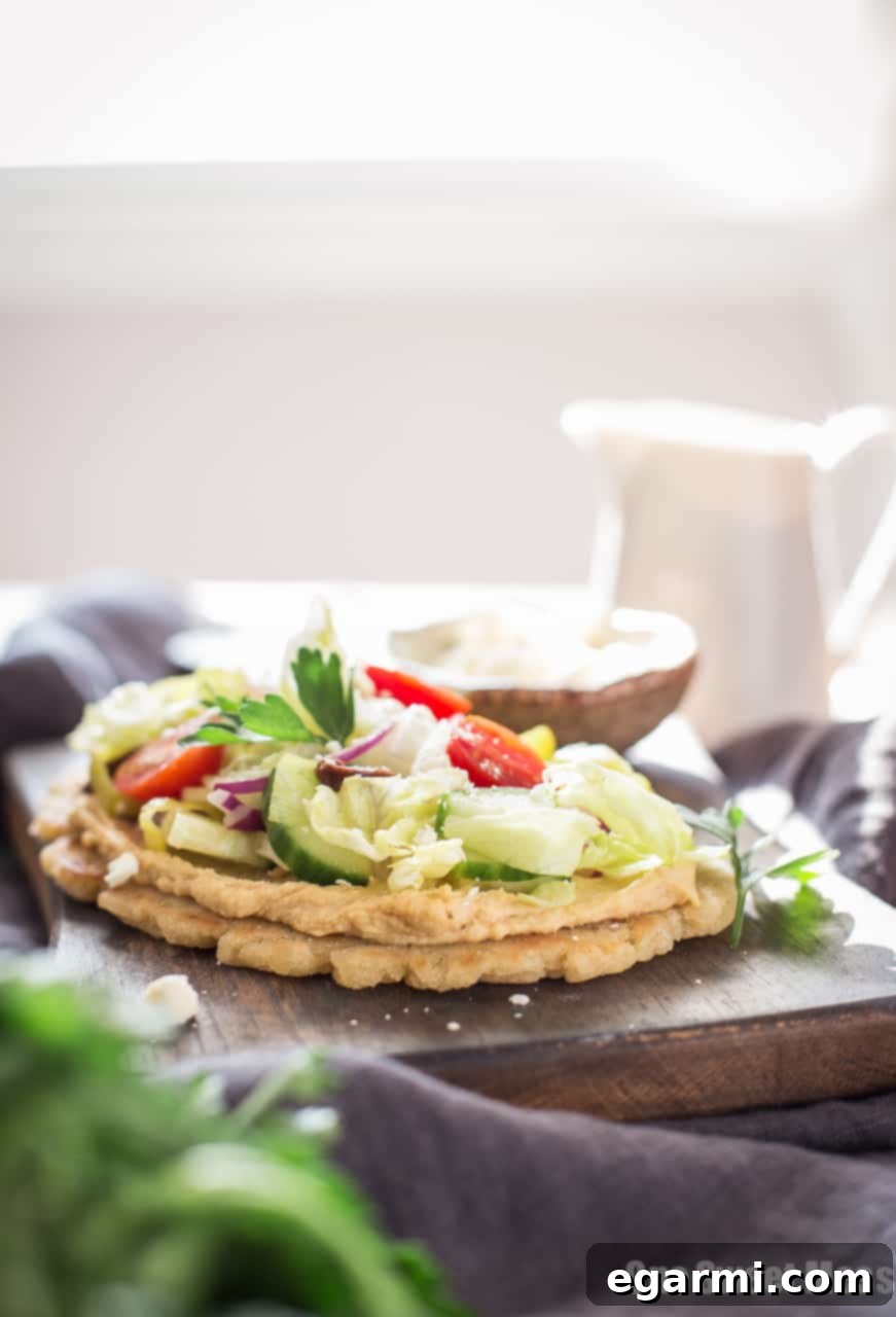 Warm Gluten-Free Naan ready to be topped with the fresh Greek salad.