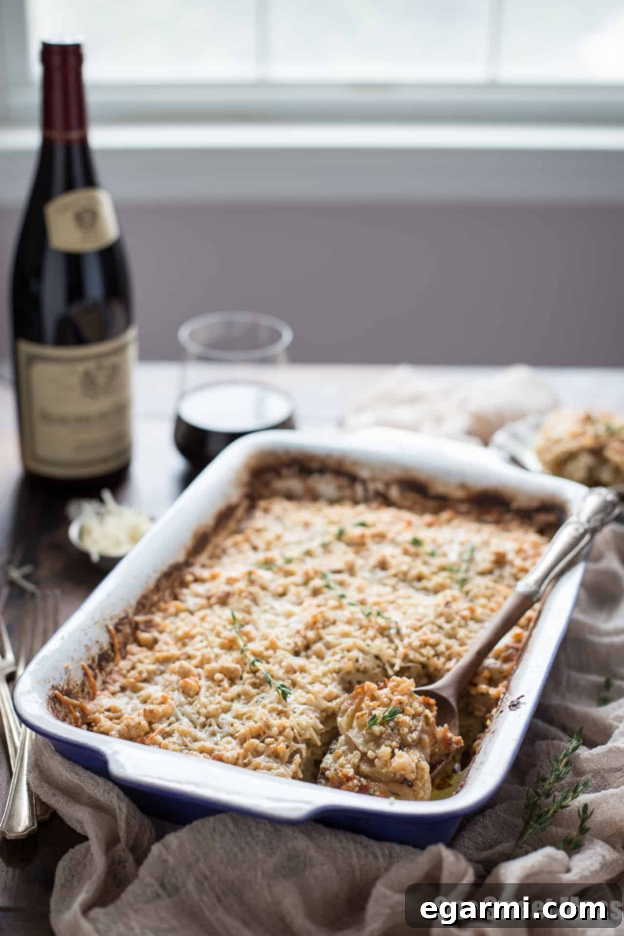 Close-up of the delicious Potato Leek Gratin with a golden crust and creamy interior, perfect for a spring gathering.