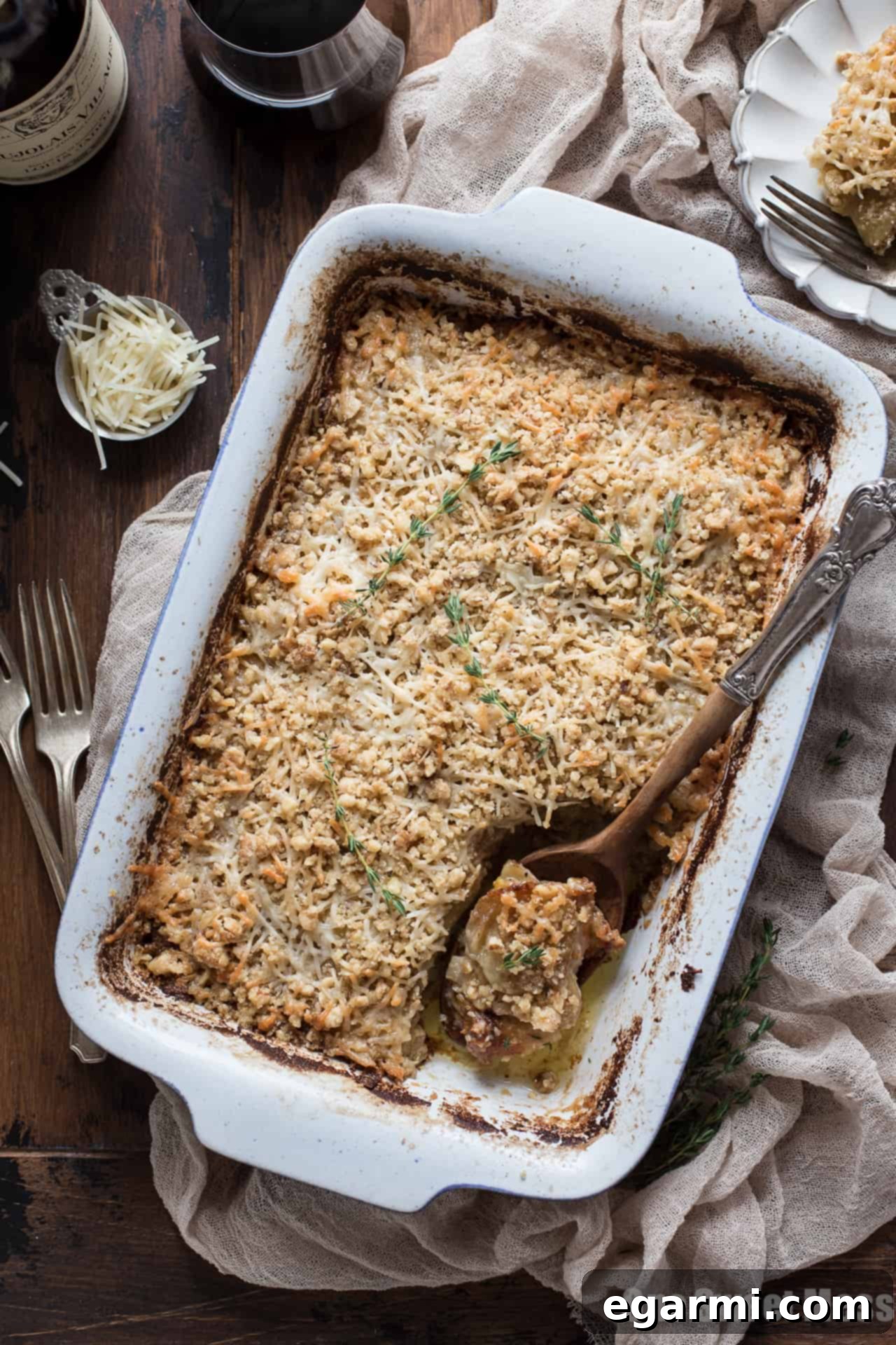 A slice of creamy Potato Leek Gratin, showcasing layers of thinly sliced potatoes, leeks, and a rich cheesy sauce.