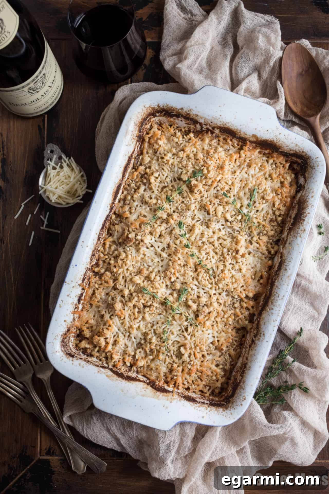 Potato Leek Gratin baking in a casserole dish, a heartwarming side dish with tender potatoes, sweet leeks, and bubbling cheese.