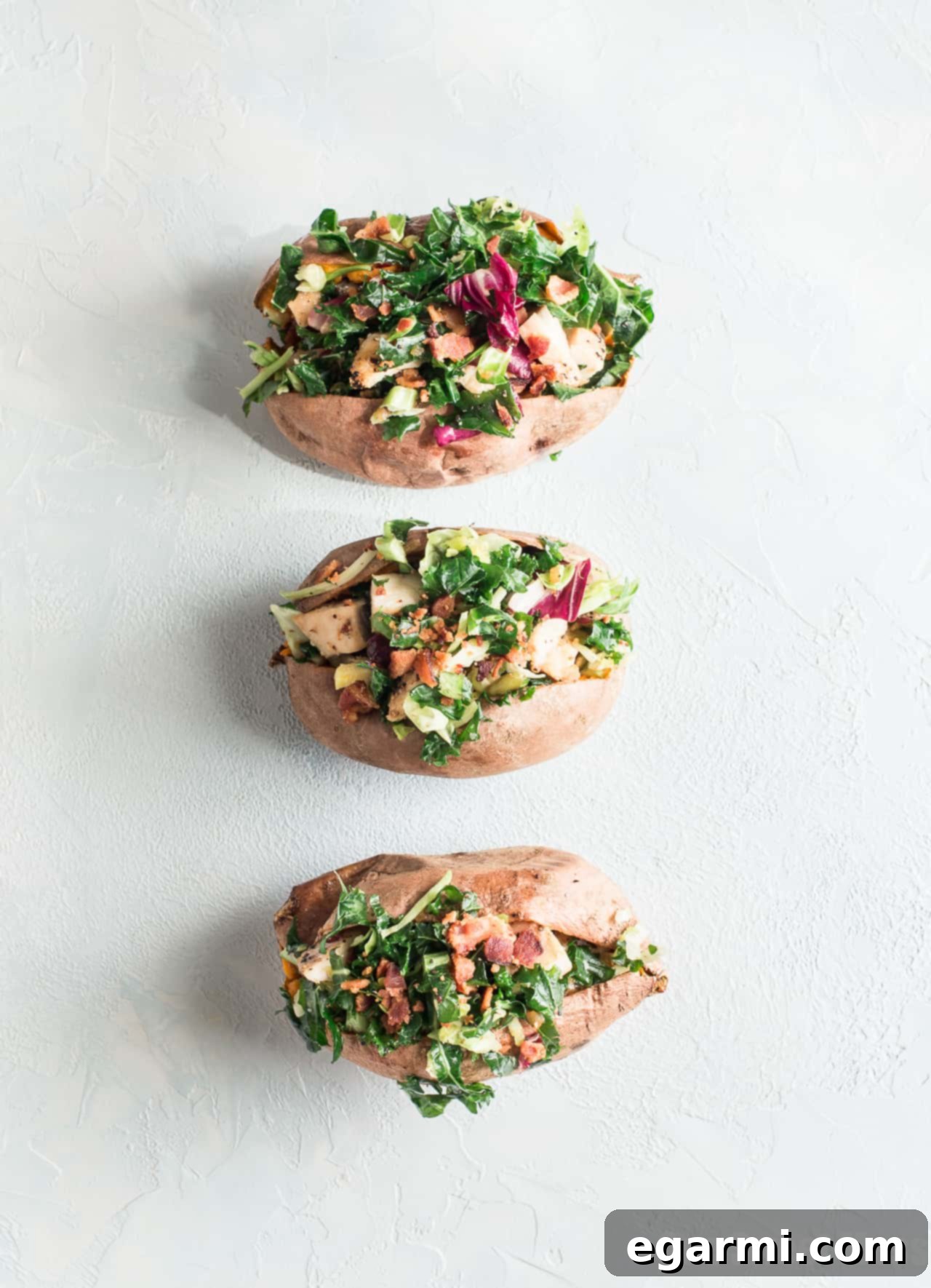 Preparation of the healthy and satisfying grilled chicken and kale stuffed sweet potatoes.