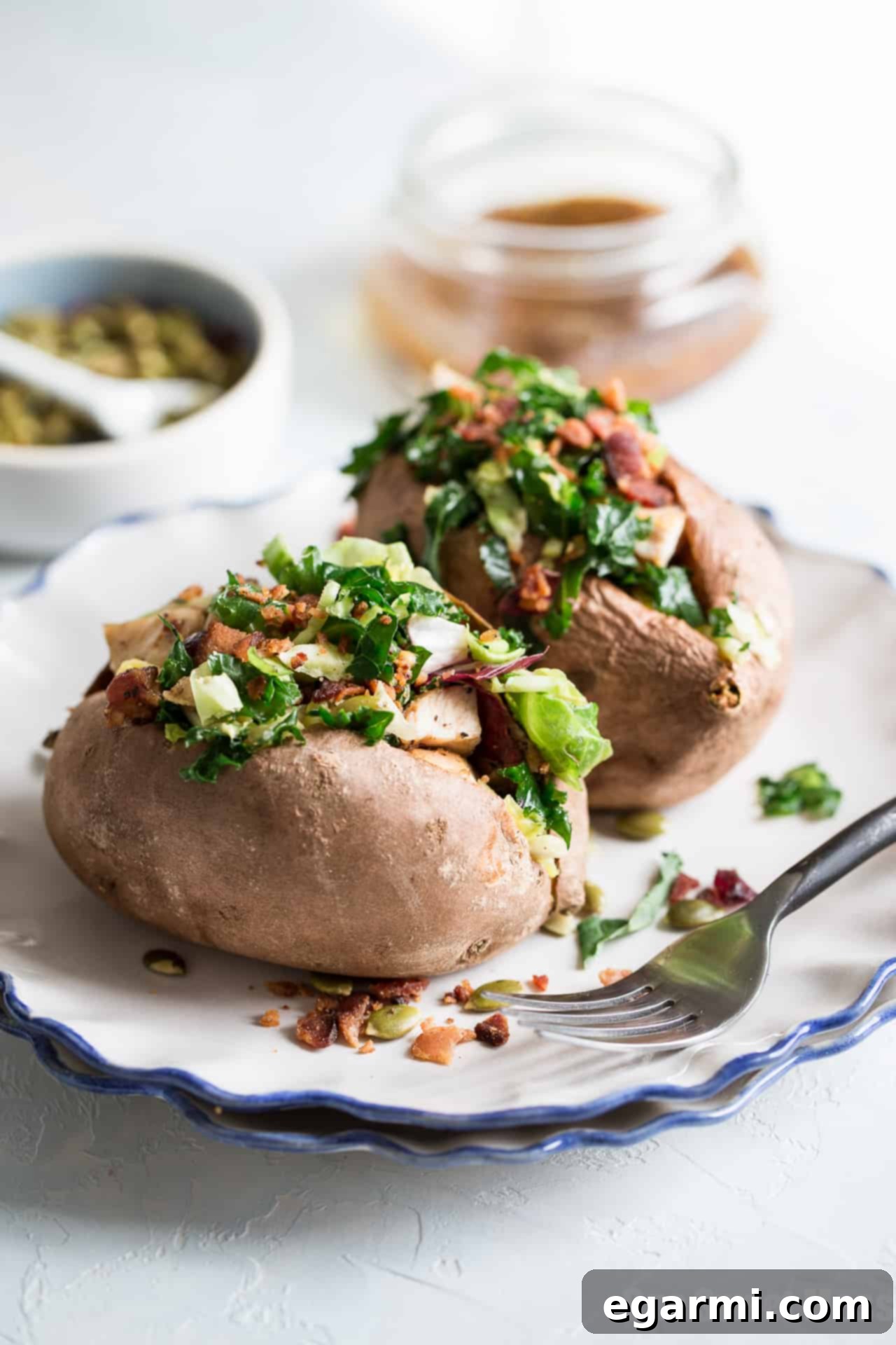 Warm bacon vinaigrette tossed with sweet kale salad, a perfect topping for stuffed sweet potatoes.
