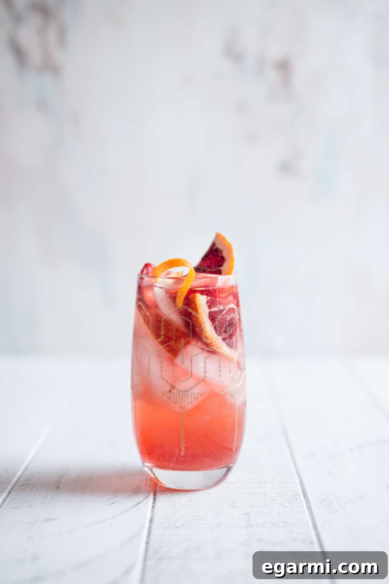 Close-up of Strawberry Campari Gin Spritz in a highball glass