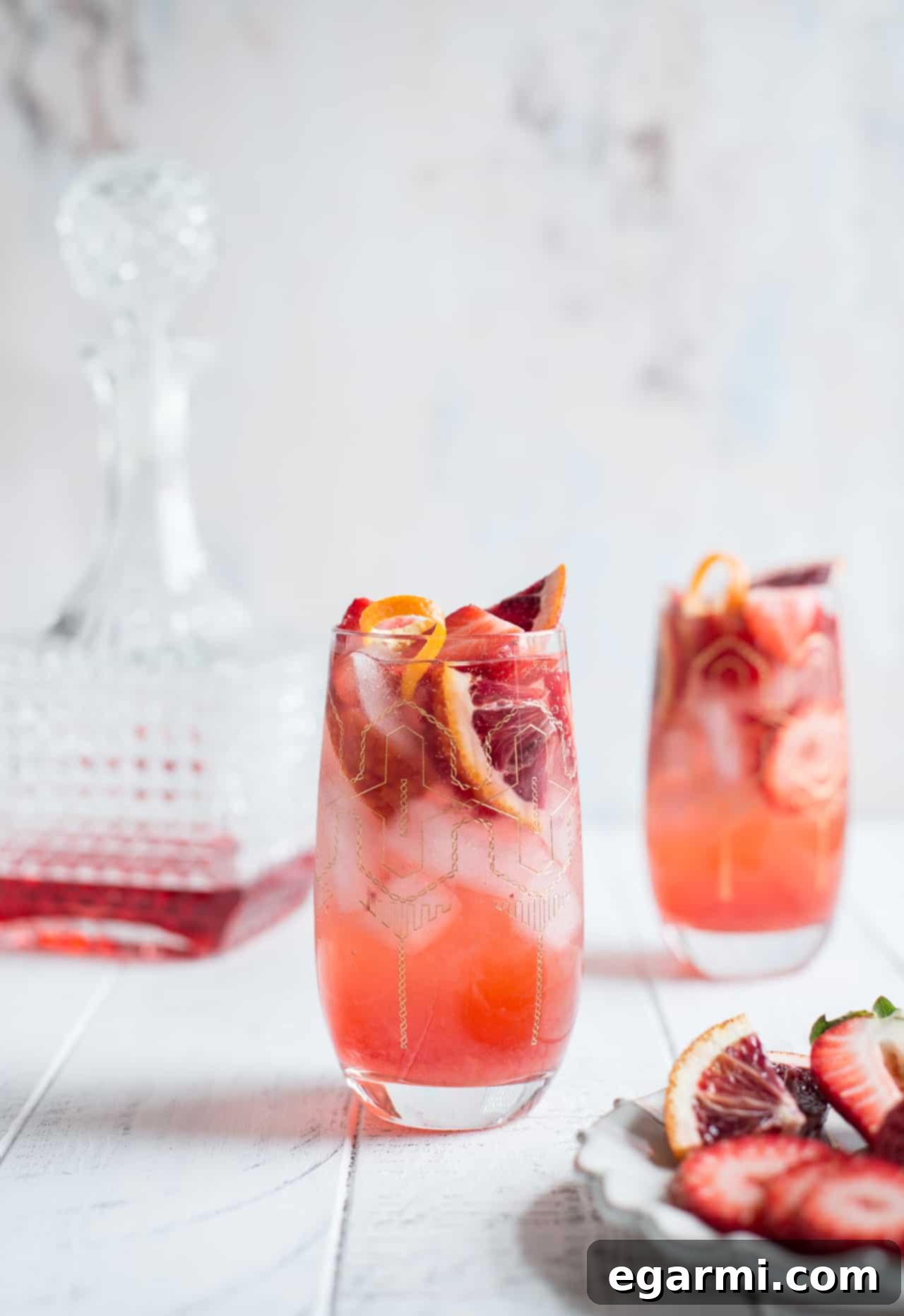 Ingredients for Strawberry Campari Gin Spritz laid out for preparation