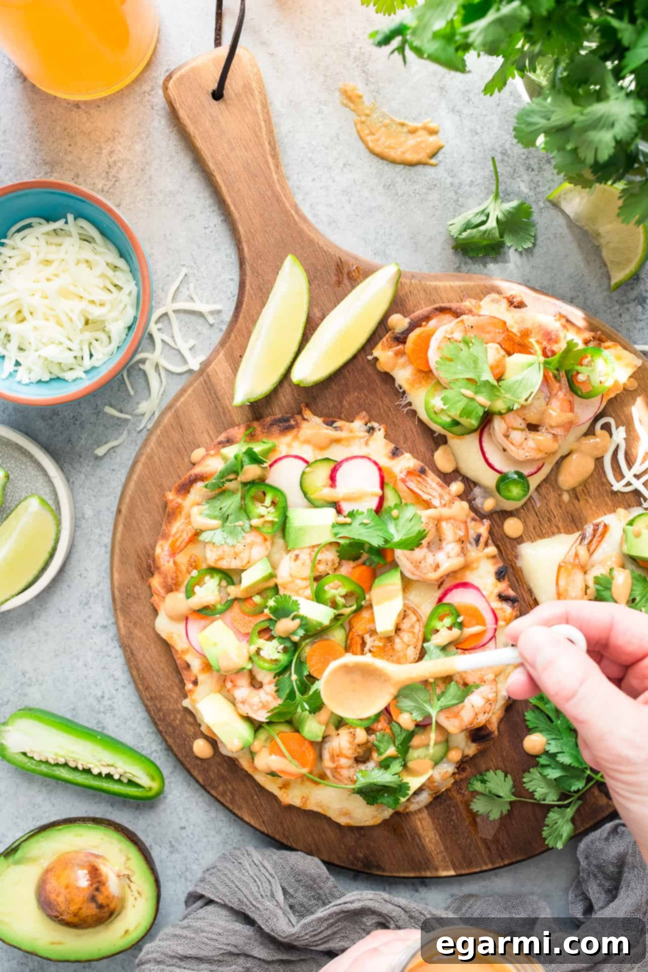 Zesty Banh Mi Shrimp Flatbread 4 Shrimp Banh Mi Flatbread Pizza being prepared on a wooden board
