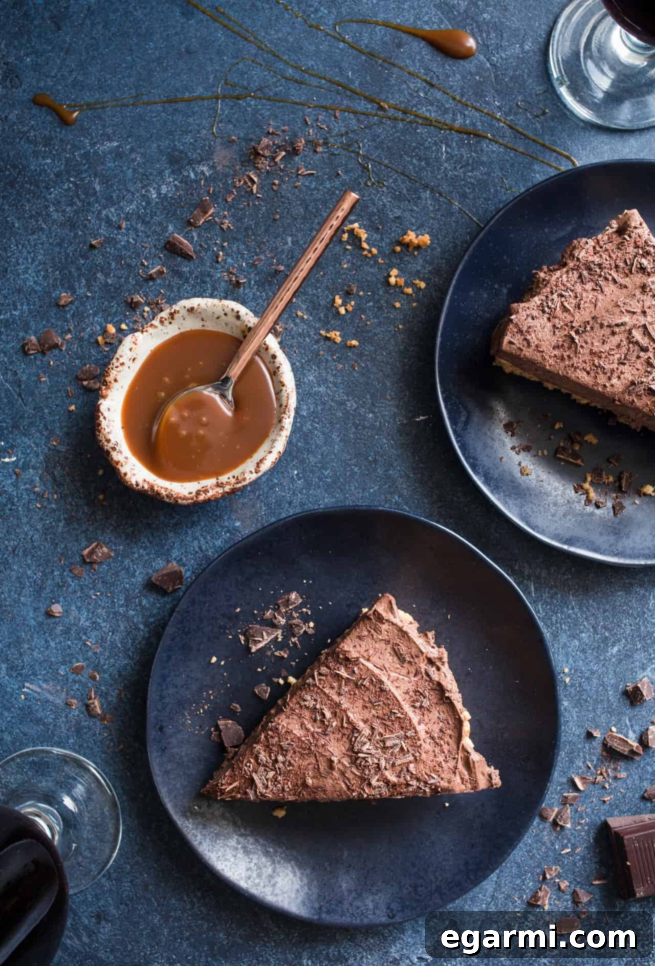 Gluten-Free Chocolate Stout Mousse Tart with Pretzel Peanut Crust - Tart on a wooden surface with a slice cut out