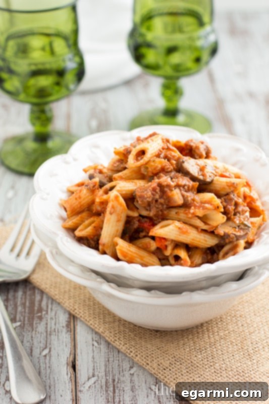 Sausage & Mushroom Ragu, a delicious and easy pasta dish perfect for entertaining. Made with Hearty Burgundy wine.